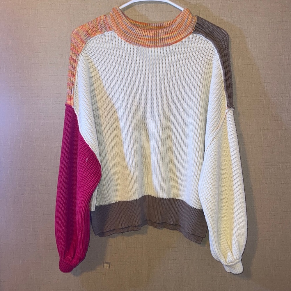 Colorful sweater with different colored sleeves